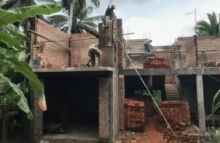 Low quality brick and mortar construction site in Sri Lanka showing outdated methods