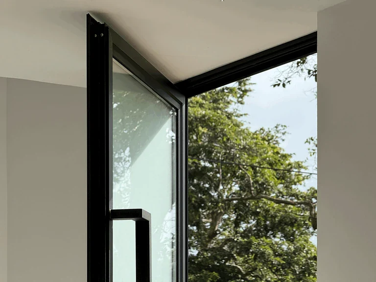 Modern black framed glass main door of a luxury home in Sri Lanka