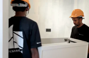 MVIVO workers installing a modern double vanity unit during construction.