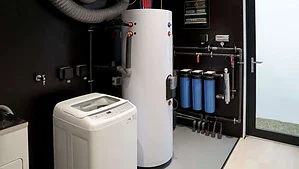 MVIVO mechanical room with hot water tank, filtration system and laundry equipment.